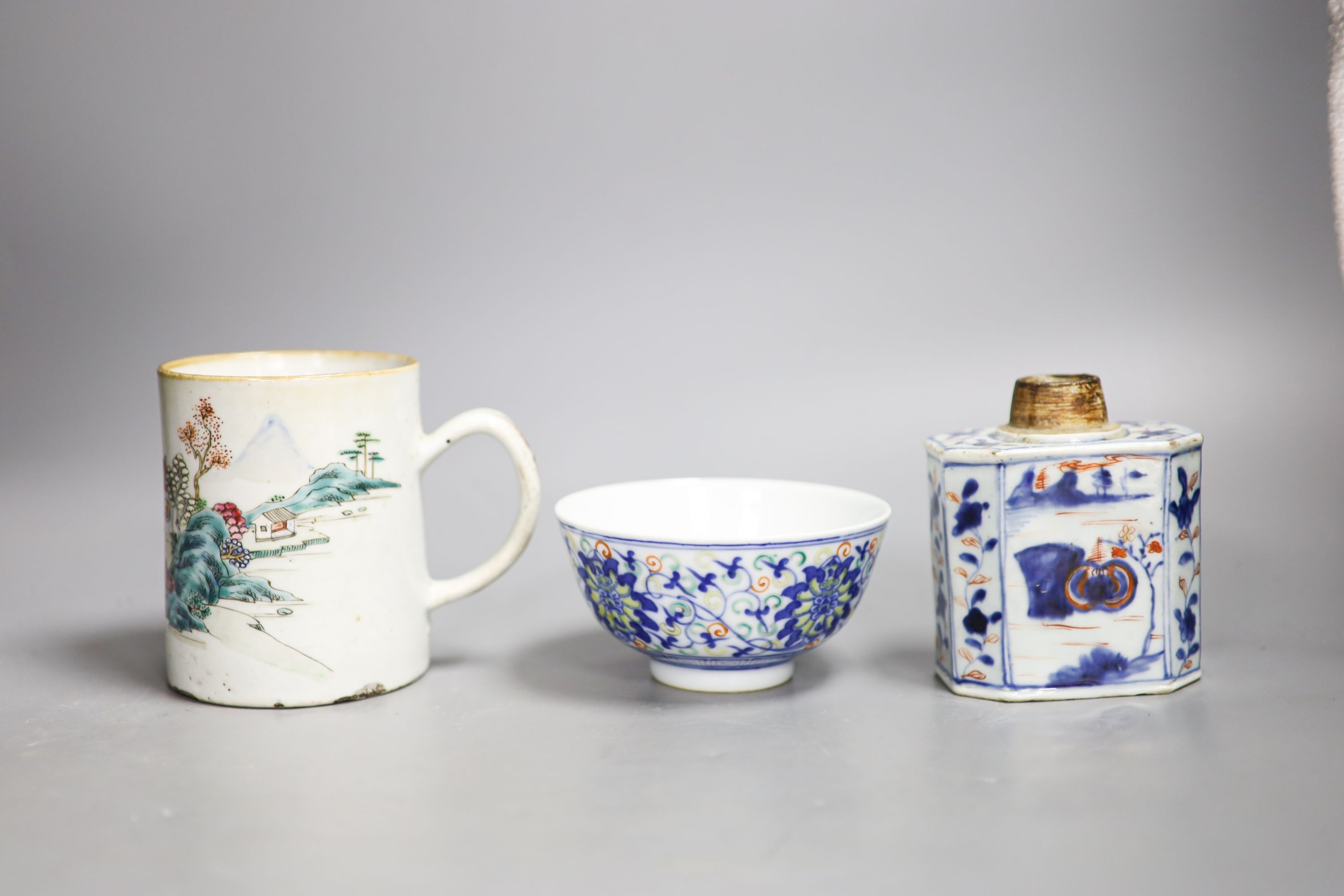 A Chinese famille rose mug, a Chinese Imari tea caddy and a doucai bowl, 18th century and later